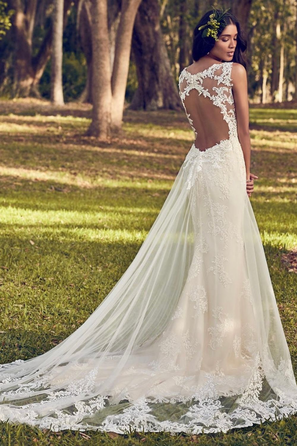Maggie Sottero Beaded lace motifs dance over tulle in this sheath 1