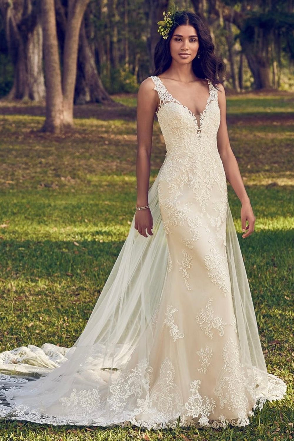 Maggie Sottero Beaded lace motifs dance over tulle in this sheath 0